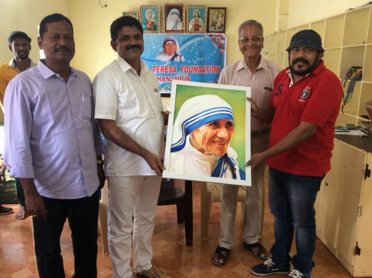 Joe malluri presenting potrait of St. Mother Teresa