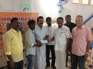 Selvan. D. Prasanth receiving cheque from chief guest