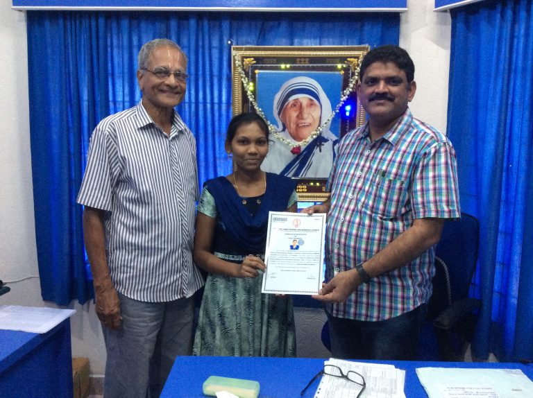 Chairman presenting the GNM certificate to Selvi. Nishanthi