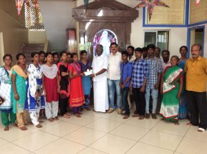 Thiru. Raj Ex-President handing over cheque to Students.